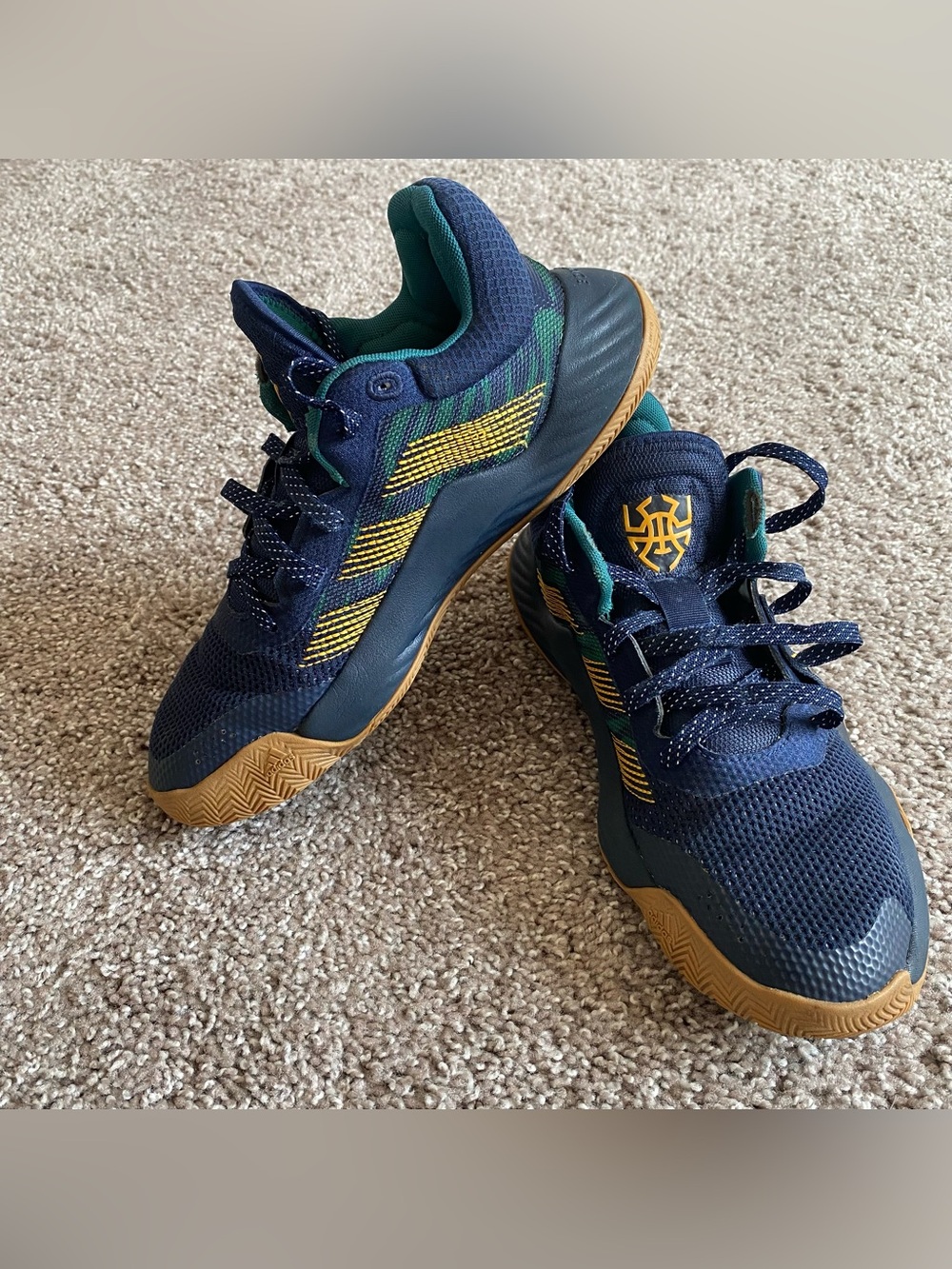 Adidas D.O.N. Issue #1 basketball sneakers in the "Be Humble" colorway